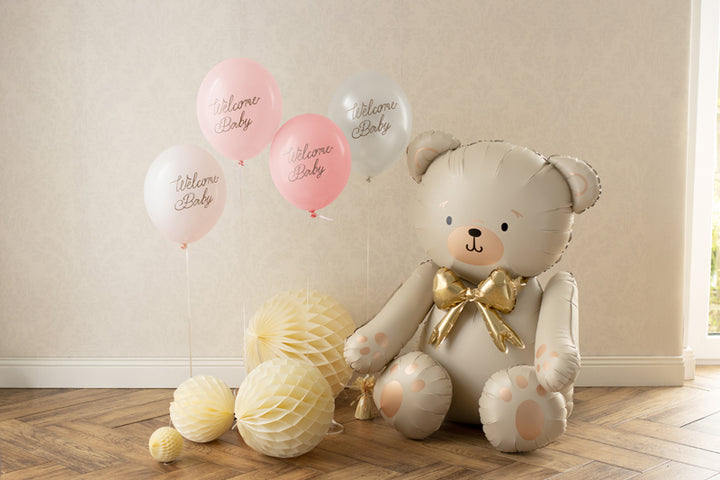 Latexballonger i vitt och rosa med texten Welcome baby , dekorerad till baby shower och dop.